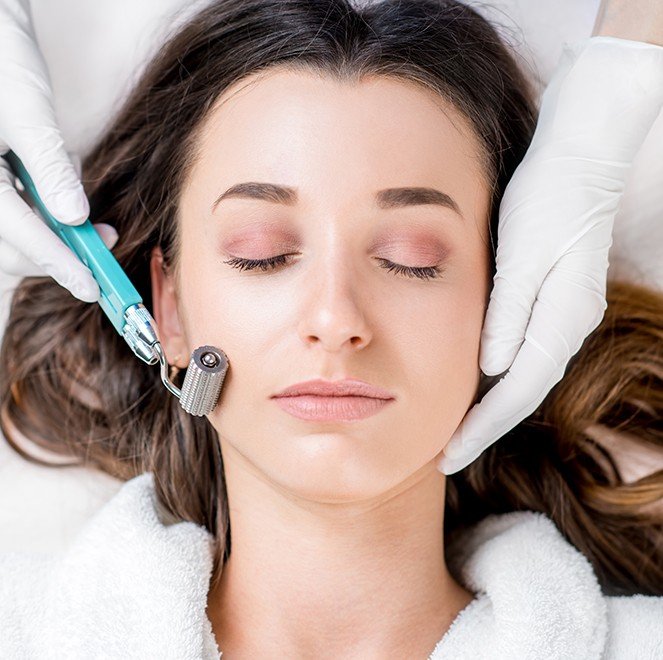 Woman receiving P R F microneedling treatment