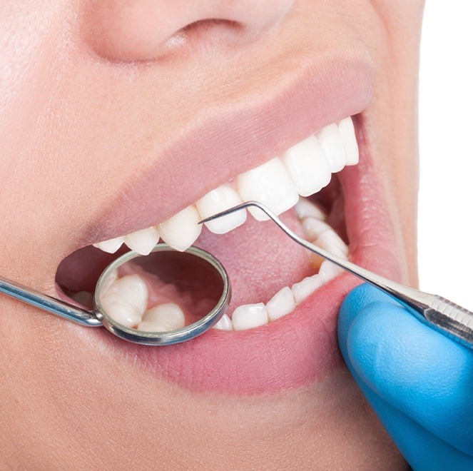 Dentist examining metal free dental restoration