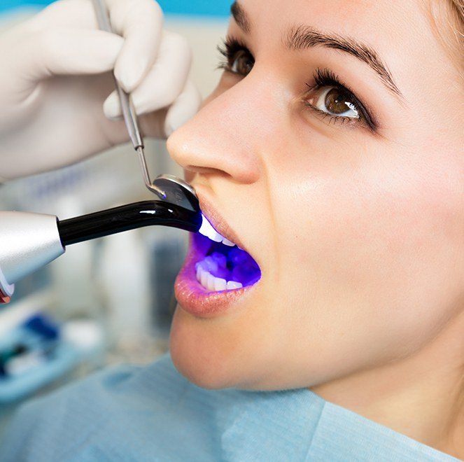 Patient receiving dental bonding treatment