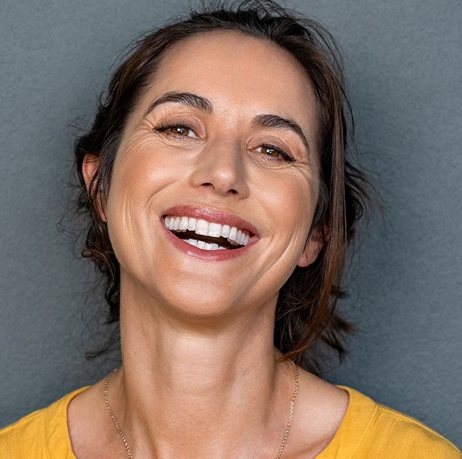 Woman sharing flawless smile after teeth whitening