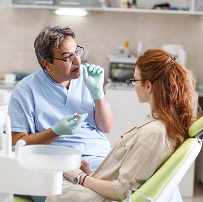 dentist talking to patient about dental emergency in Jacksonville