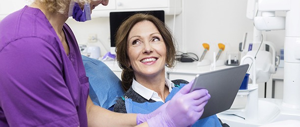 Older woman visiting an implant dentist in Jacksonville