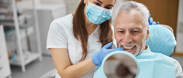 Dentist smiling at his dental implants in Jacksonville with a dentist