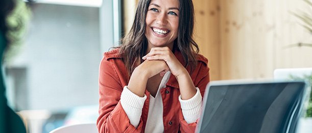 Woman smiling during work meeting at office