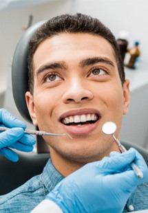 a patient undergoing a dental checkup near San Marco