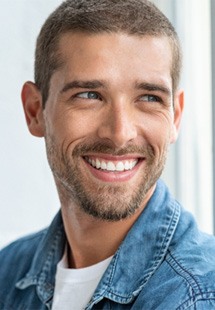 a man smiling after cosmetic dentistry near San Marco