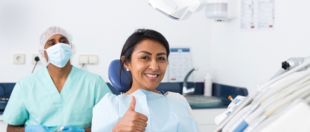 woman giving a thumbs up for oral conscious sedation in Jacksonville