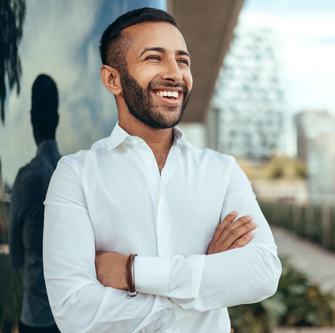 Man standing outside smiling after visiting emergency dentist in Jacksonville, FL