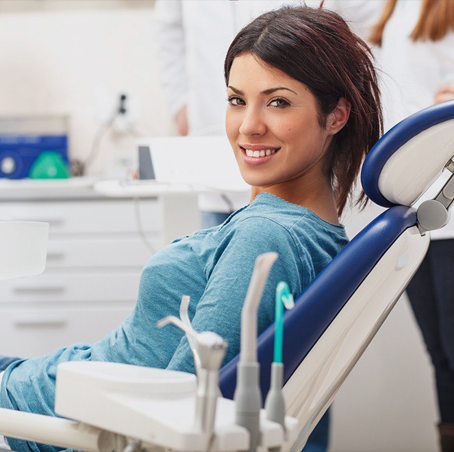 Woman in dental office for dental checkup and teeth cleaning