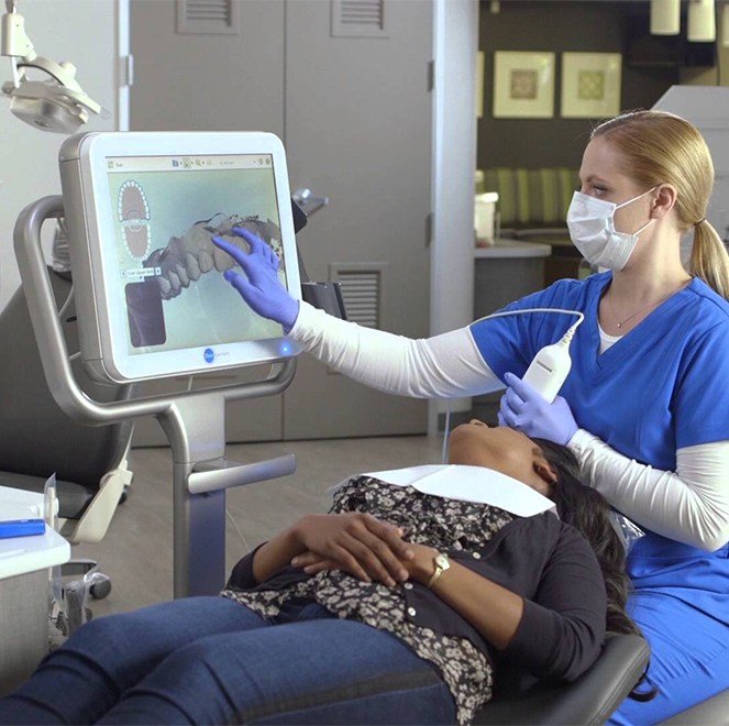 Dentist and patient looking at intraoral images