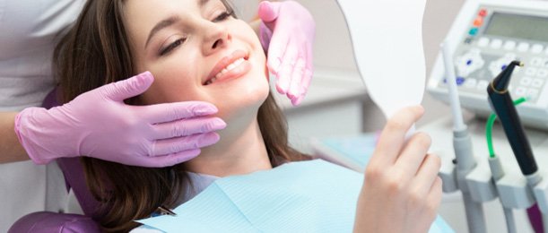 a patient smiling after receiving her veneers in Jacksonville