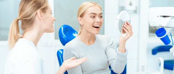 a patient smiling after receiving her veneers in Jacksonville