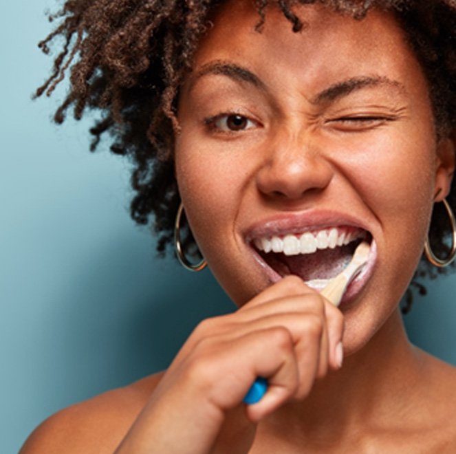 Woman brushing her teeth