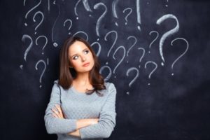 woman confused about the difference between dental crowns and fillings