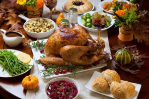 Table spread with delicious Thanksgiving foods