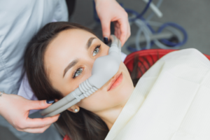 a patient smiling and receiving sedation dentistry 