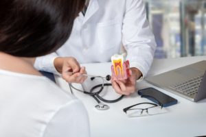 a patient speaking with their dentist about root canal treatment